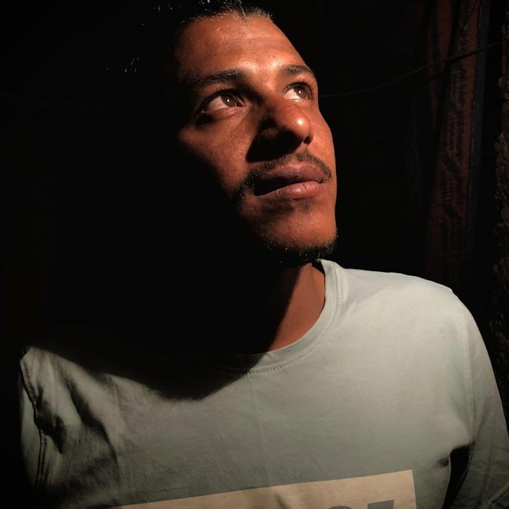 Kaveri Mehta, Lead Design Curator at Quiet Paper Frame, reviewing corporate floral arrangements